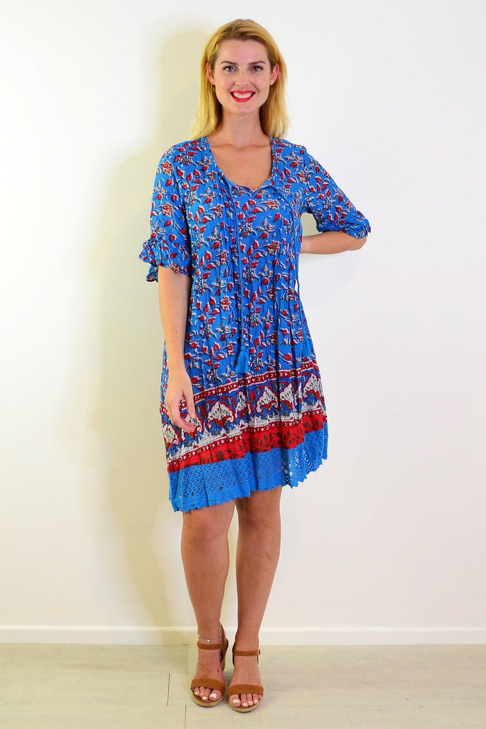 Red and blue boho tunic dress by One Summer, featuring a relaxed fit and vibrant patterns, displayed on a hanger.