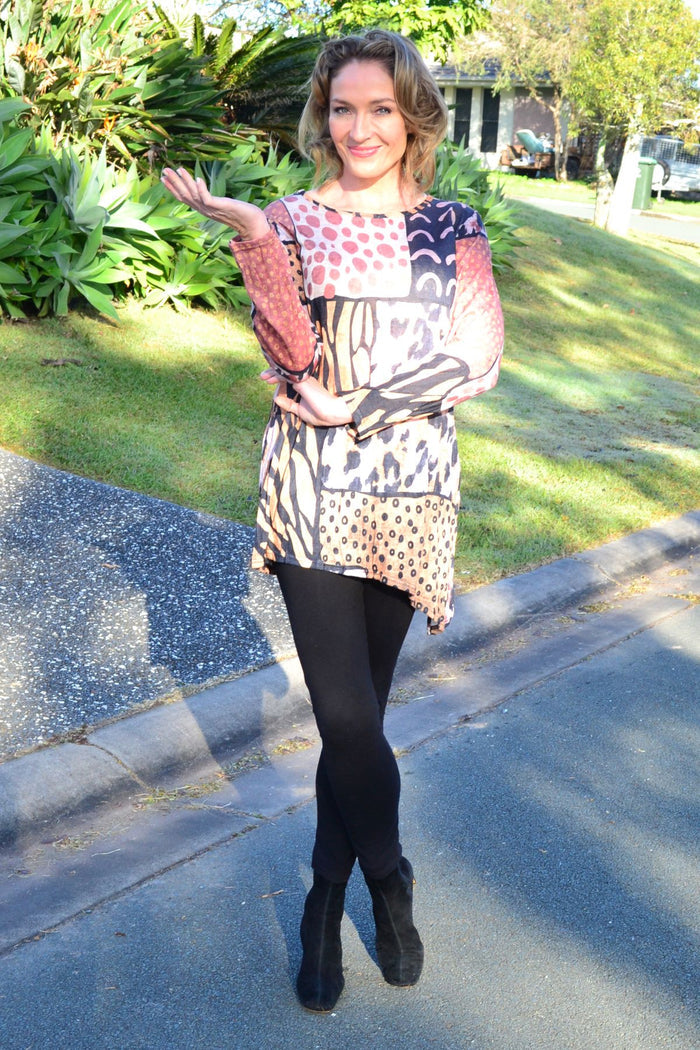 Wild Patch animal print crinkle tunic top from Cafe Latte featuring a loose fit and vibrant animal print fabric.
