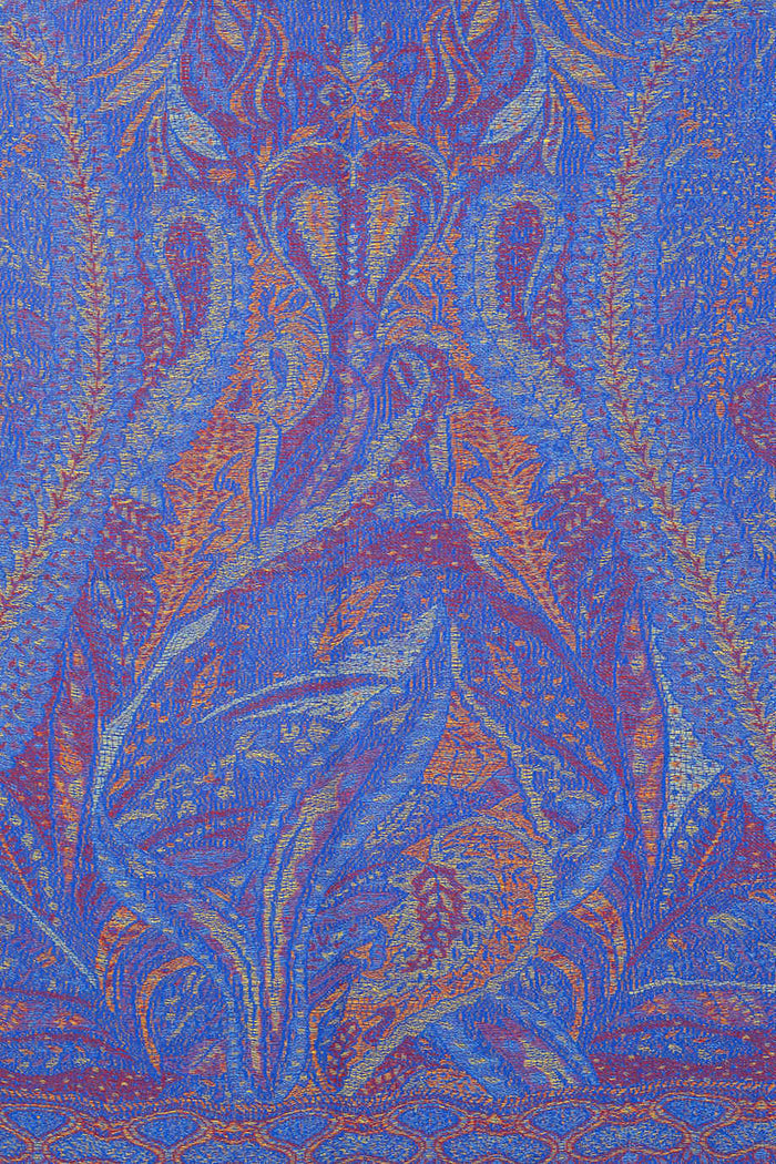 Blue paisley print scarf wrap from ivys, featuring a soft fabric and intricate paisley design, styled as a versatile fashion accessory.