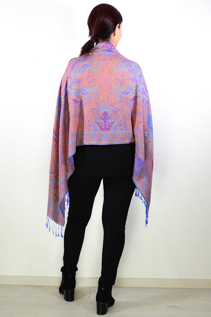 Blue paisley print scarf wrap by ivys, featuring intricate paisley patterns and soft fabric, styled as a versatile women's accessory.