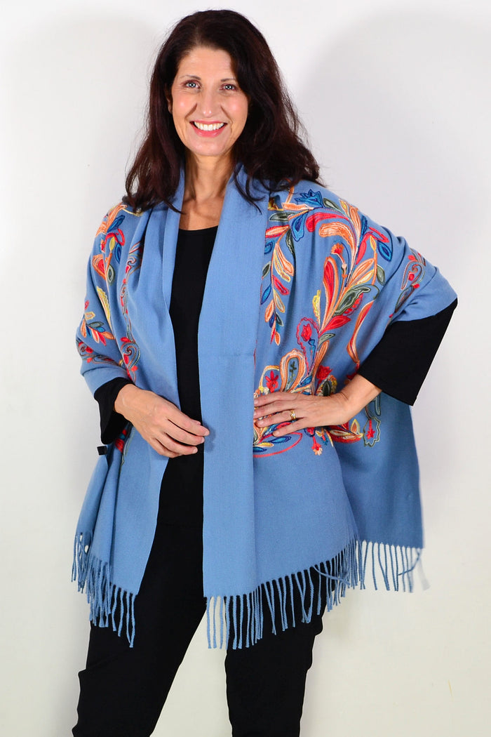 Blue soft embroidered scarf wrap from ivys, featuring delicate embroidery and lightweight, cozy fabric, draped elegantly.