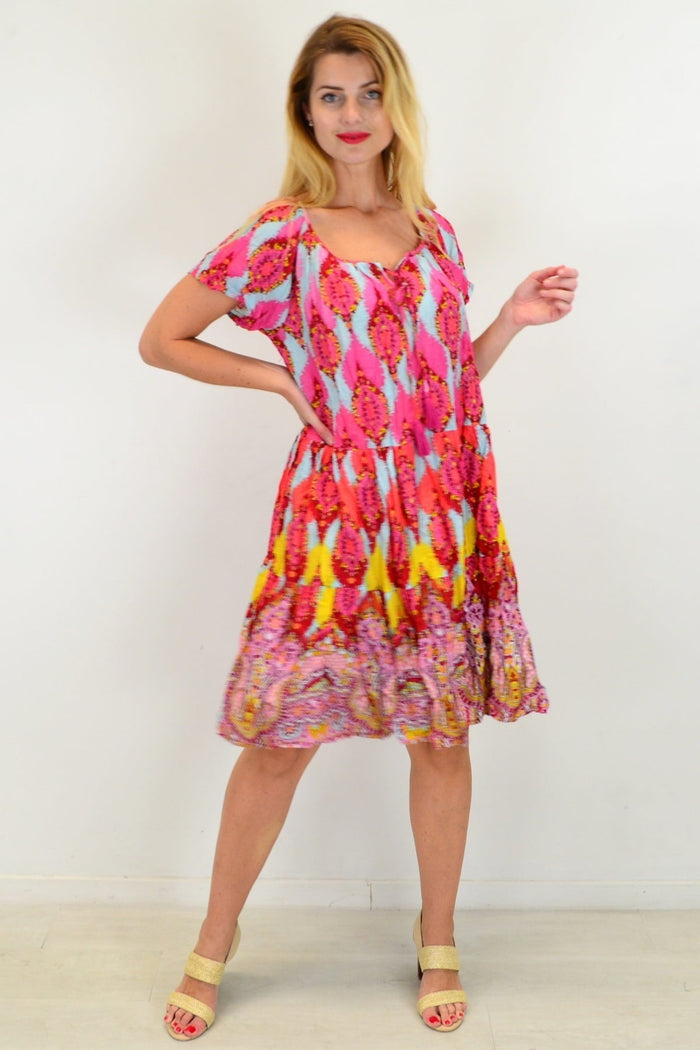Cherry mosaic shift dress by One Summer, a cotton tunic with vibrant cherry patterns, displayed on a hanger.
