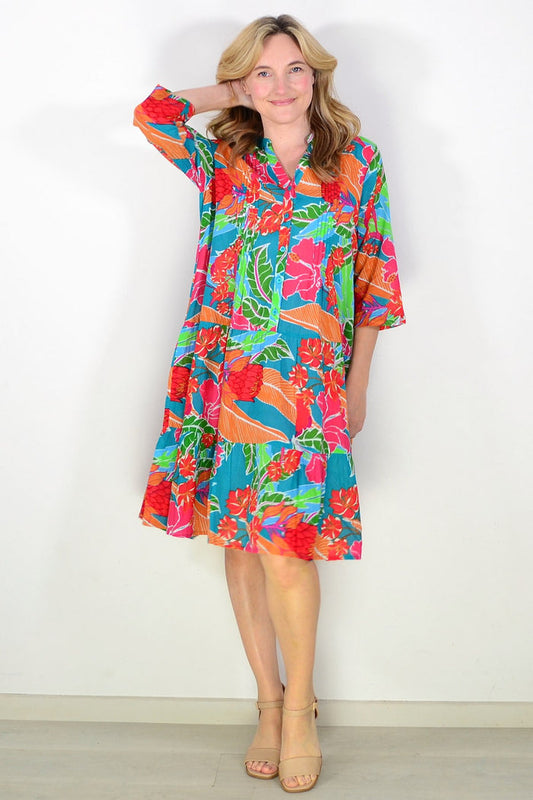 Colorful blue Beth tunic dress by One Summer, flowing fabric and vibrant pattern, displayed on a mannequin.