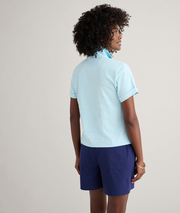 Model is wearing UNTUCKit Cotton Knit Shelby Polo in Solid Aqua Blue.