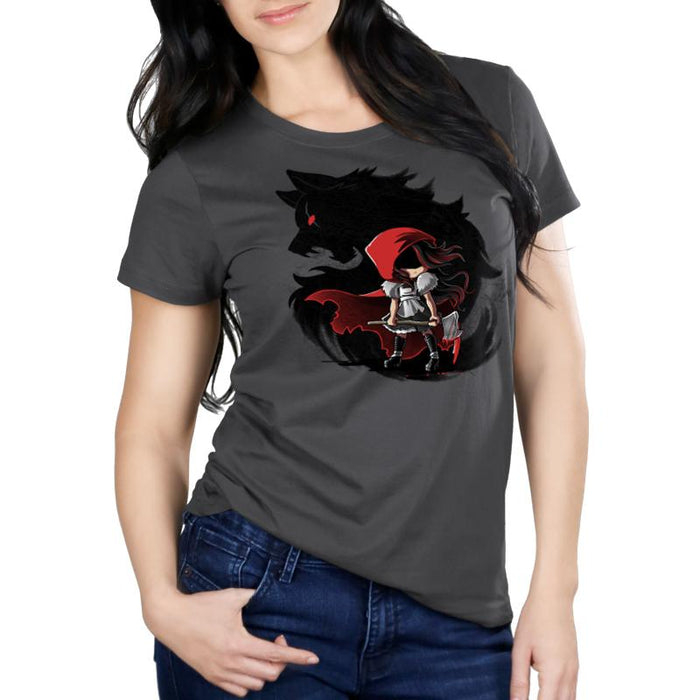 Premium Cotton T-shirt_TeeTurtle Dangerous charcoal gray t-shirt featuring a girl wearing a red riding hood holding an axe in front of a swirling silhouette of a wolf with a red eye, straight out of reading dark fairy tales.