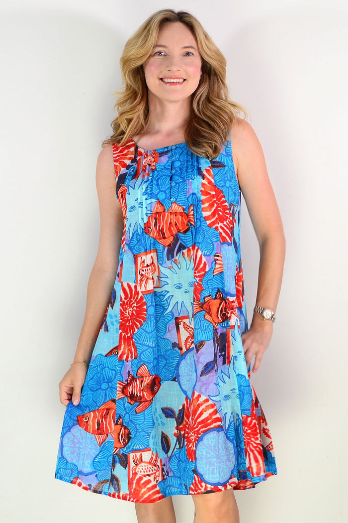 One Summer Estelle sleeveless crew neck tunic dress displayed on a hanger, showcasing its simple, elegant design and soft fabric.