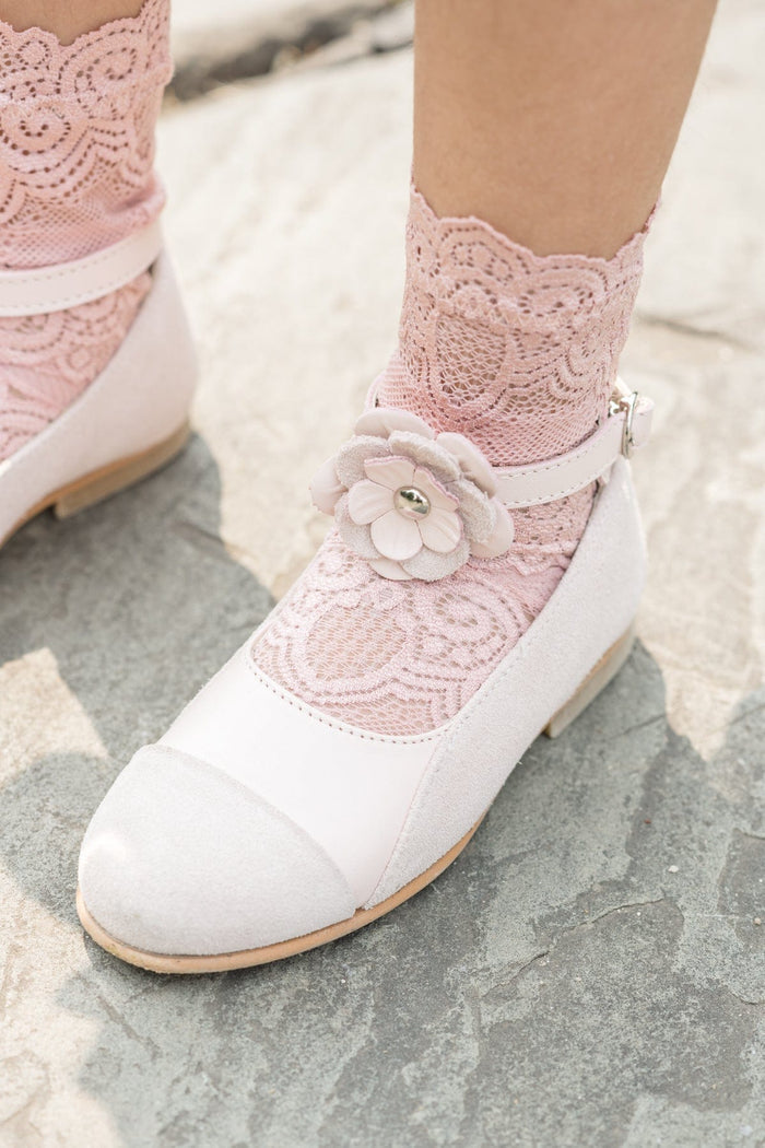 Faina pink leather mary jane shows styled with blush lace knee high socks, featuring floral strap embellishment and soft suede toe for dress occasions