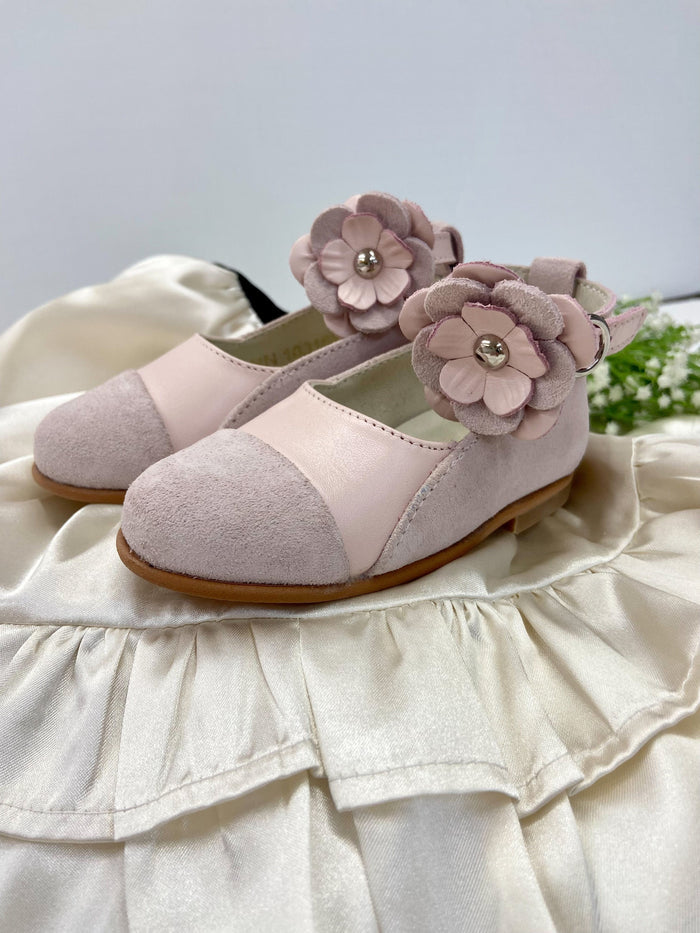 Close up of Faina pink leather Mary Jane shoes featuring layered flower strap and soft suede toe