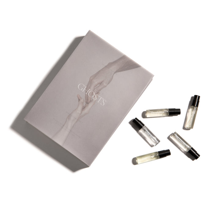 Set of 2ml perfumes with a branded box on a white background