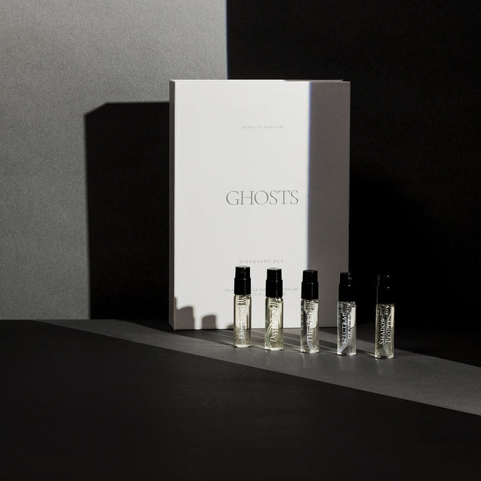 Set of perfume bottles and packaging with 'GHOSTS' branding on a dark background