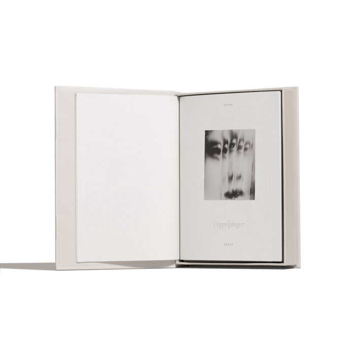 Open book with a black and white image on a white background