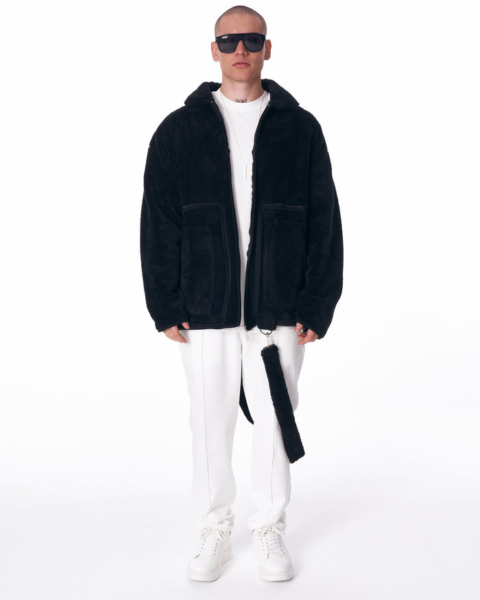 Martin Valen men's black plush cardigan, full front view showing zip closure and a long plush strap hanging