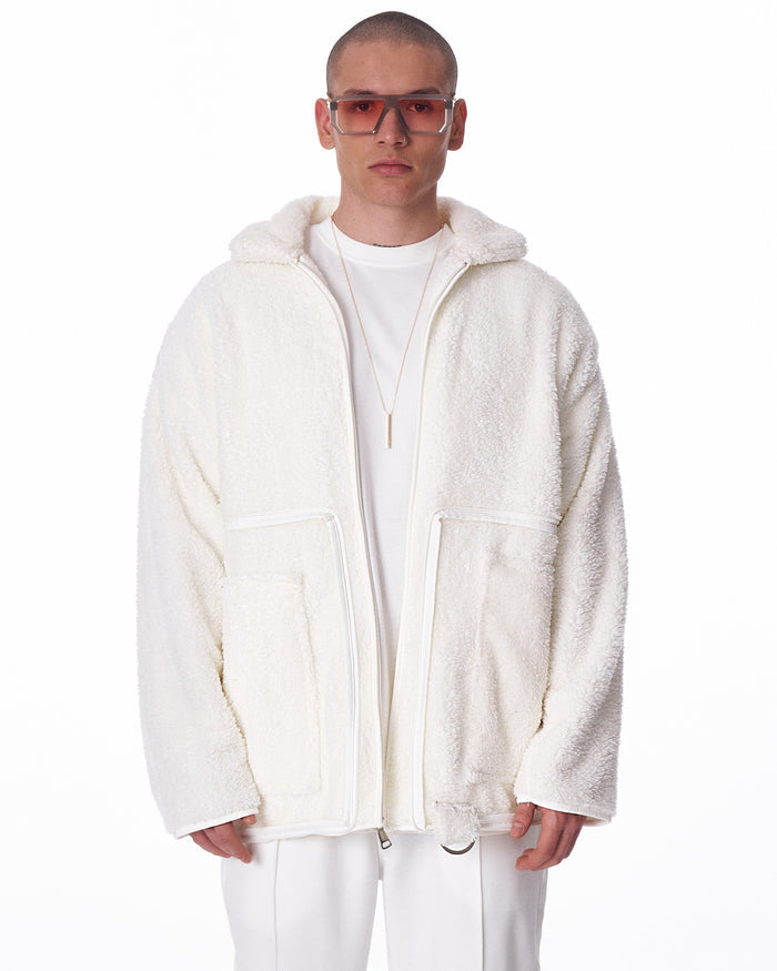 Martin Valen off‑white plush cardigan, mid‑body view showing patch pockets and partial zipper