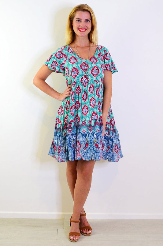 Kimberley V neck tunic dress by One Summer, shown in a flowing fabric with a relaxed fit and V-shaped neckline.