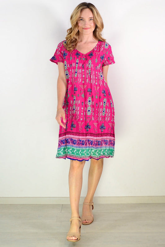 Pink Leela V-neck smock dress from One Summer, styled as a comfortable tunic with a relaxed fit and soft fabric.