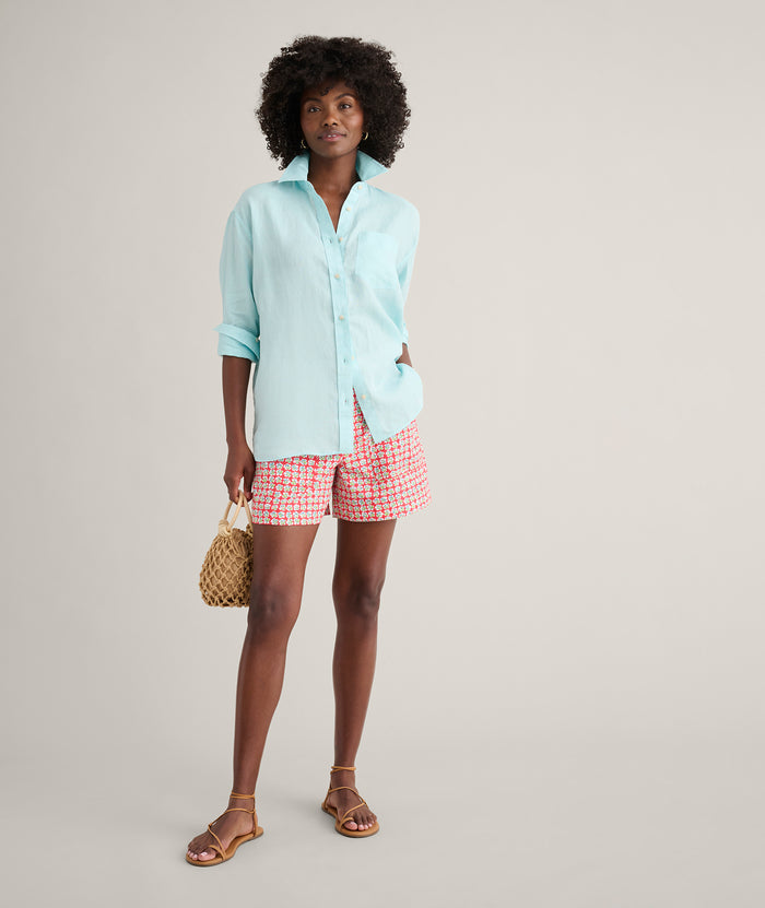 Model is wearing UNTUCKit Wrinkle-Resistant Linen Relaxed Fit Melanie Shirt in blue.