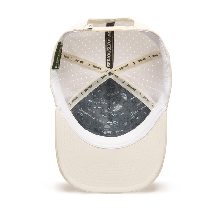 Beige baseball cap shown from underneath, revealing a white mesh interior with small dots, beige stitched bands reading SERIOUSLY KIND, and dark gray lining at the crown decorated with small graphics and playful text.