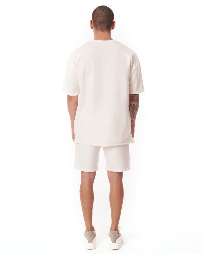 Martin Valen white men's oversize shortsuit, full rear view showing long tee and knee‑length shorts