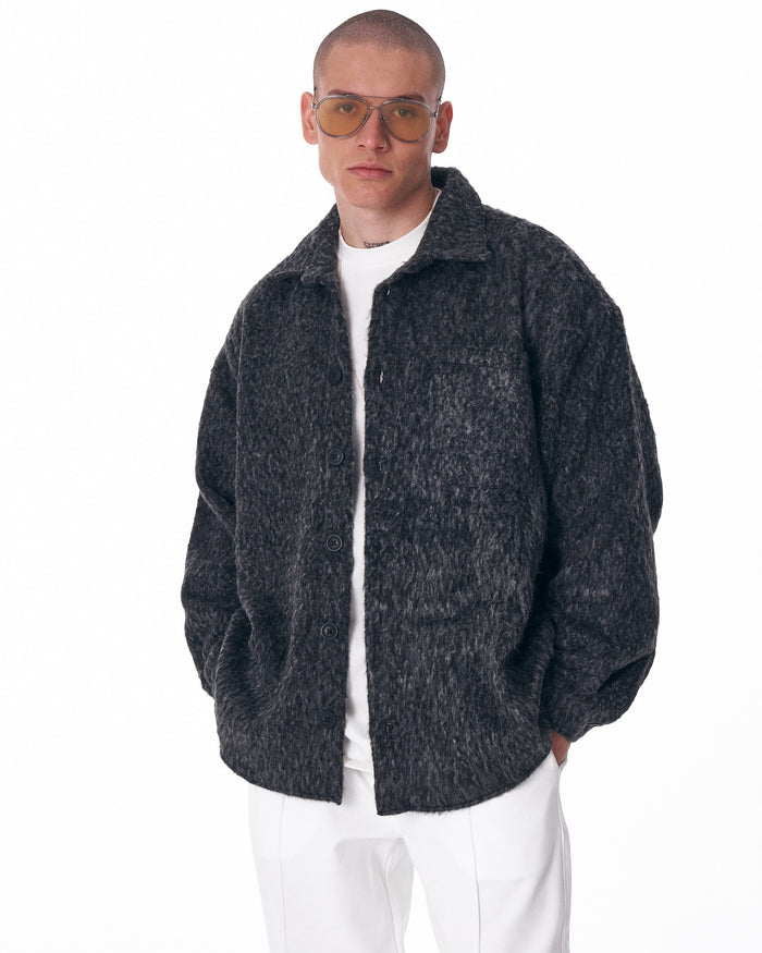 Martin Valen dark grey button-down wool cardigan, front mid-body view worn by model