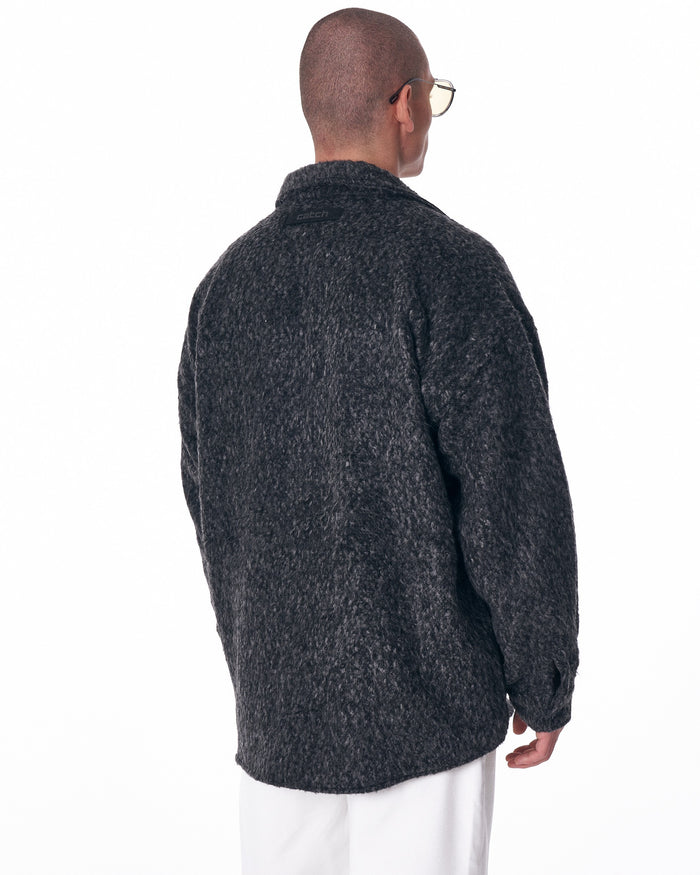 Martin Valen men's wool button-down cardigan in dark grey, rear view showing raised collar and textured knit