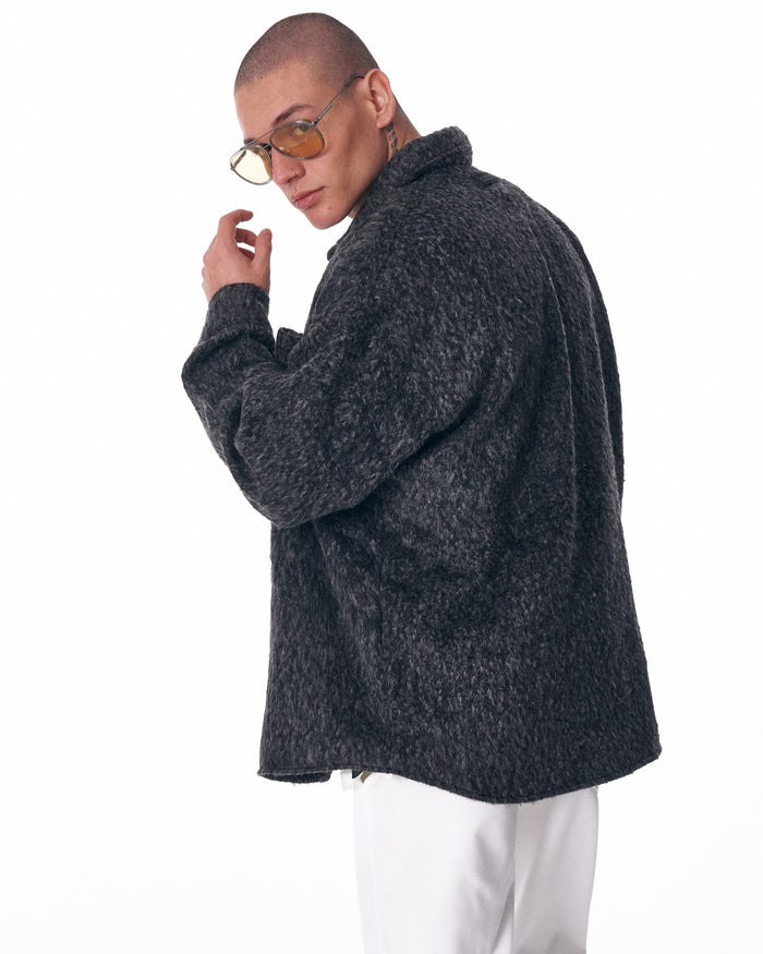 Martin Valen men's wool cardigan in dark grey, three-quarter back view highlighting oversized fit and long sleeve
