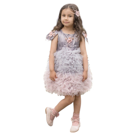 Girl wearing the Mia grey and pink ombre cupcake tule dress with layered ruffle skirt, floral details, and cap sleeves