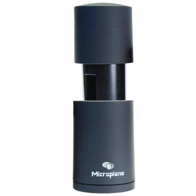 Black microplane grater on a white background