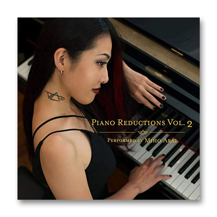 image of the album artwork for miho arai- piano reductions volume 2. it features a photo of a woman sitting at a piano, photographed at a slightly higher angle. on her neck is a steve vai logo tattoo in black. The steve vai logo makes the word "vai" with an upside down triangle, a right side up one, and a line going across the triangles with a curl at the end next to the triangle that is upright. across the image reads "piano reductions vol 2, performed by miho arai".