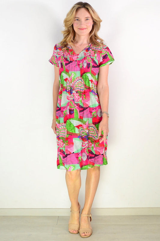 Nicola cap sleeve cotton tunic dress by One Summer, shown in natural fabric with a relaxed fit and simple neckline.