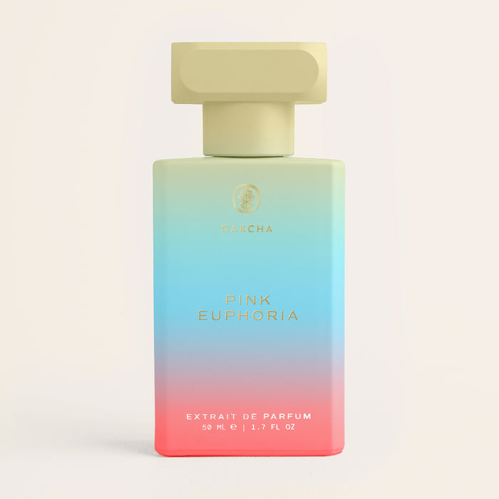 Front view of Pink Euphoria perfume bottle with ombre pink-to-teal glass and rectangular beige cap on neutral background