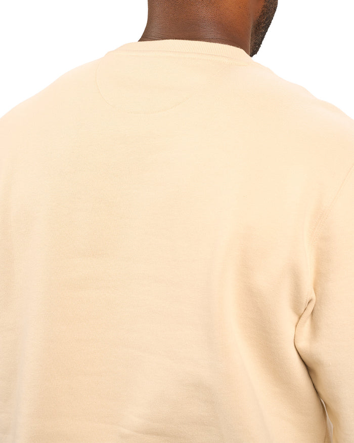 man wearing an oatmeal colored sweater from Black Clover with a 3d text BLCK CLVR on the chest