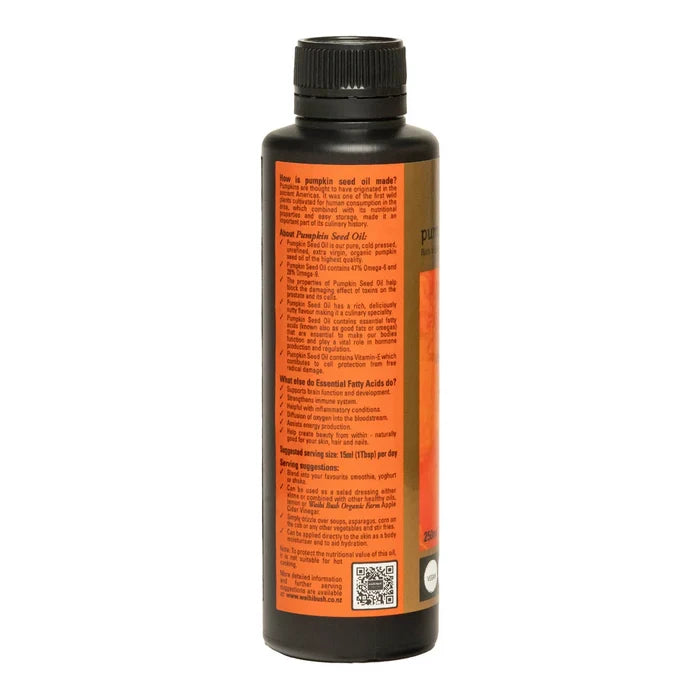 Side of Pumpkin seed oil bottle with information about its benefits, how it's made & serving suggestions.