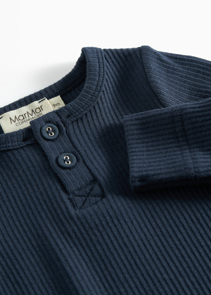 Ribbed blue baby jumpsuit in soft material with long sleeves, long legs and buttons