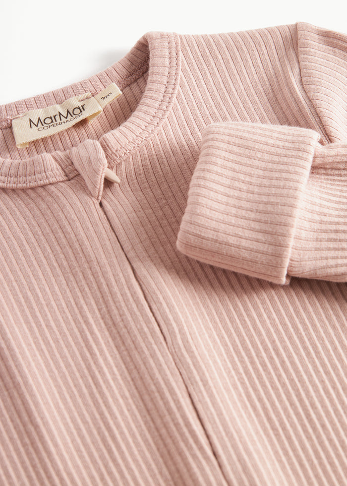 Ribbed pink baby jumpsuit in soft material with long sleeves and long legs and zipper