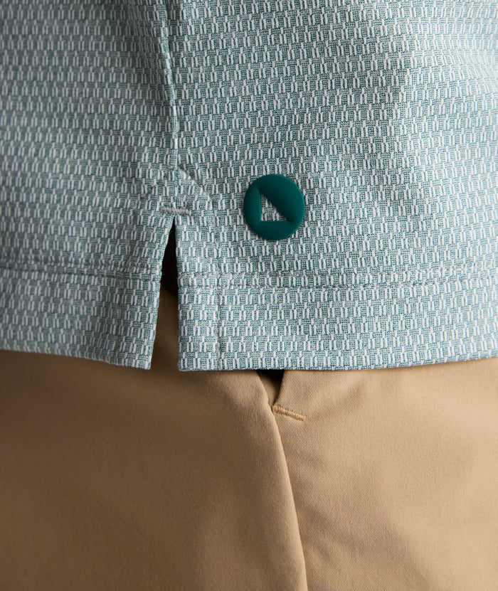 Model is wearing UNTUCKit Textured Performance Polo in green.