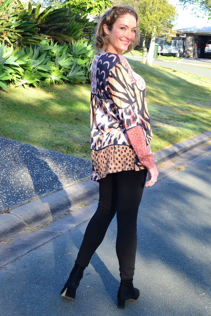 Wild Patch animal print crinkle tunic top by Cafe Latte, featuring bold animal patterns and relaxed fit fabric.
