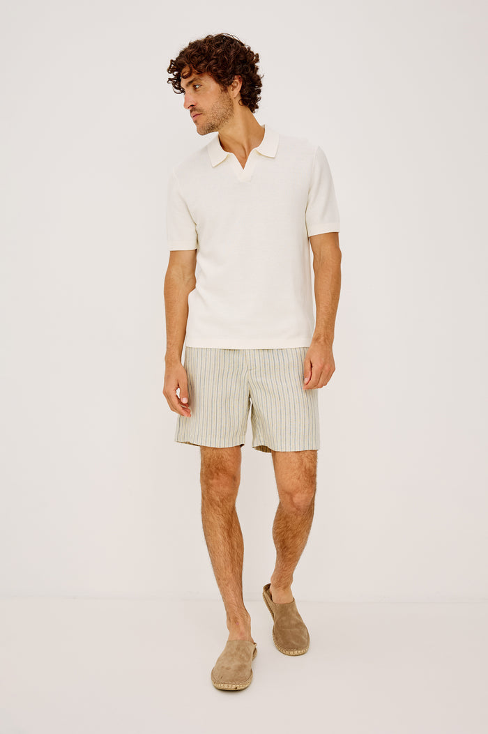 Wilson Short in Linen With a Straight Fit, Clean Front Waistband, Elasticated Back, Front Zip Fly, and Side Pockets in Ecru Multi Stripe Colorway - Full Body Front View Featured on Model