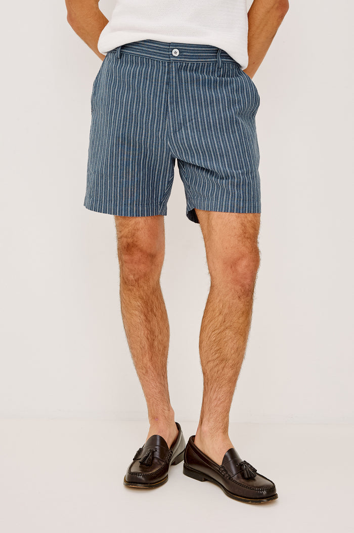 Wilson Short in Linen With a Straight Fit, Clean Front Waistband, Elasticated Back, Front Zip Fly, and Side Pockets in Navy Multi Stripe Colorway - Lower Body Front View Featured on Model