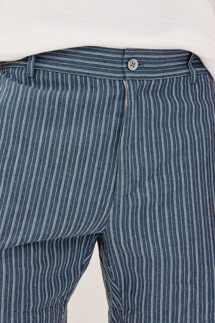 Wilson Short in Linen With a Straight Fit, Clean Front Waistband, Elasticated Back, Front Zip Fly, and Side Pockets in Navy Multi Stripe Colorway - Lower Body Front View Featured on Model
