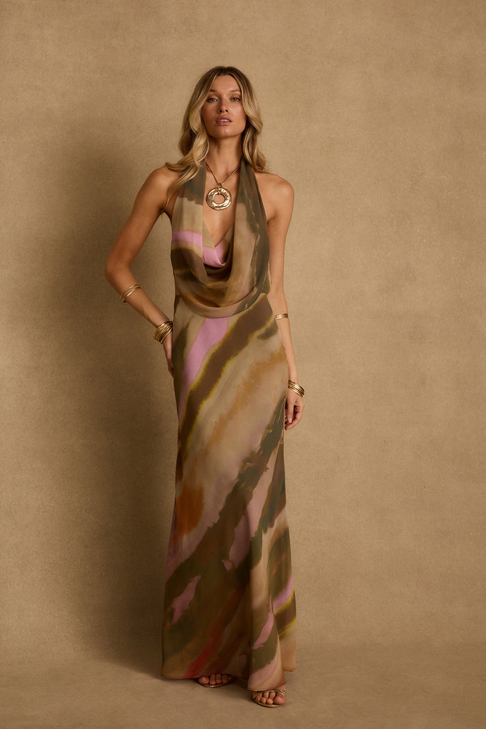Windansea abstract print halter maxi dress with draped cowl neckline, styled with gold jewelry.